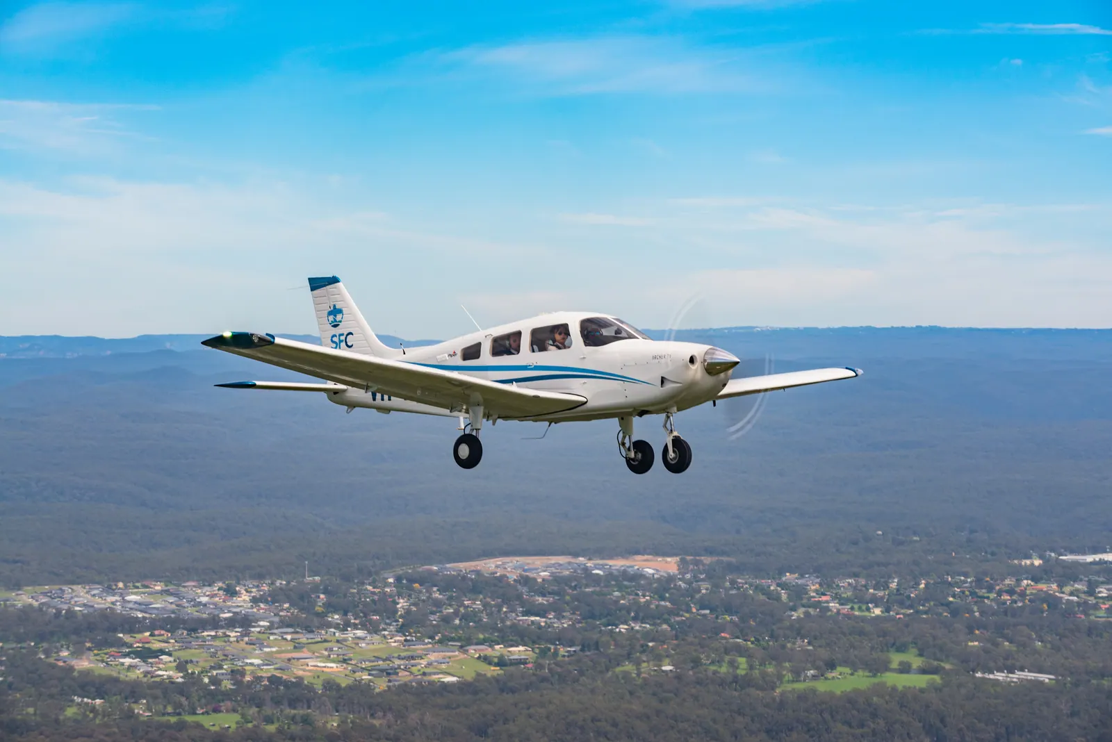A Piper Archer in flight